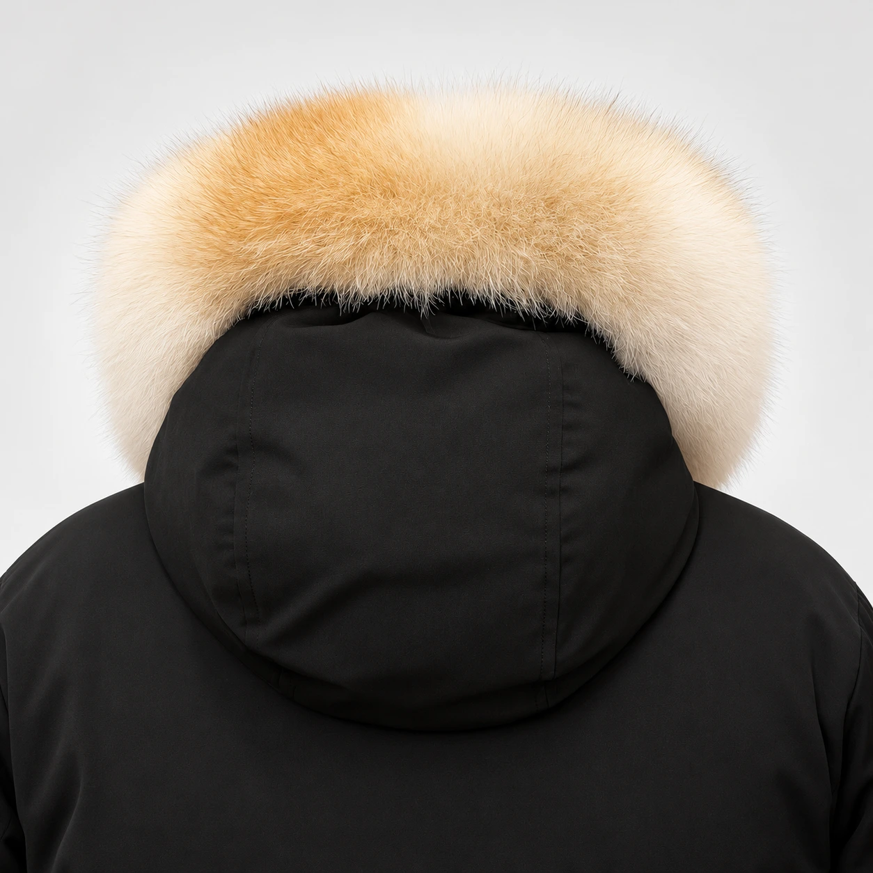 Rear view of a golden cream fur replacement trim around a black Canada Goose hood