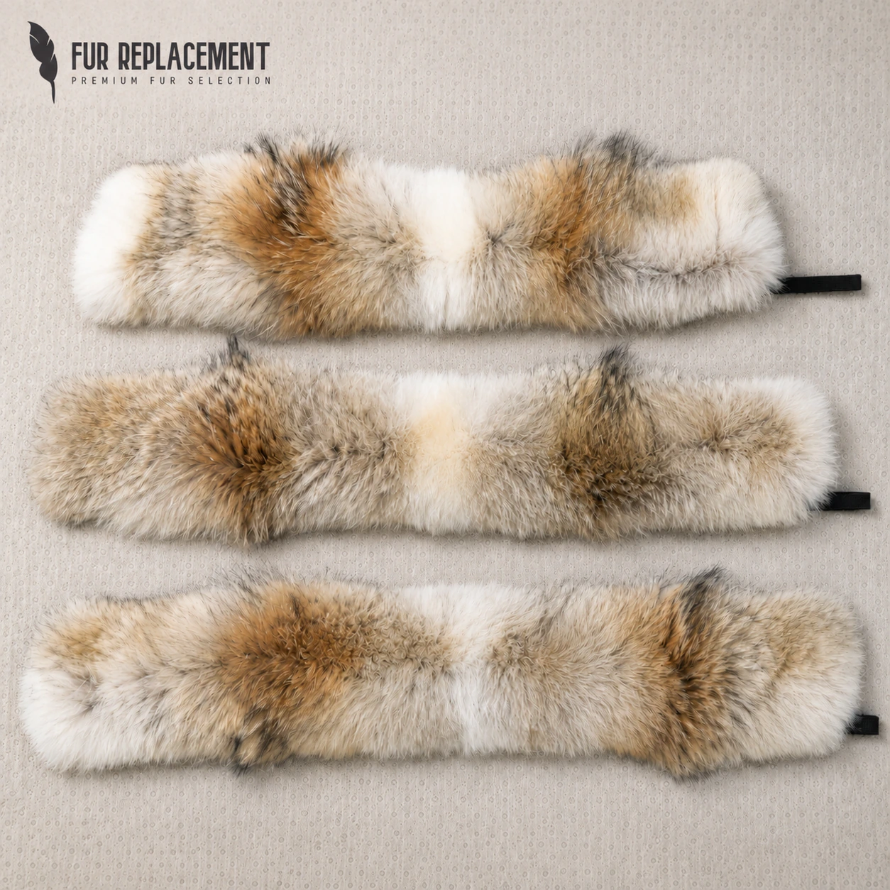 Three genuine coyote fur replacement trims laid flat to compare natural colour and markings